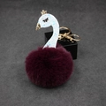 Detail of burgundy faux fur swan keychain with golden crown and sparkling white neck - Purplish Red