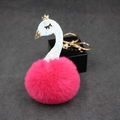 Detail of creative swan plush keychain with pink fur ball and golden crown charm - Rose Red
