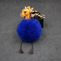 Detail of creative giraffe plush pom-pom keychain with blue fur and golden ring - 8cm Faux Rabbit Fur / Sapphire Blue