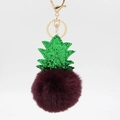 Detail of dark purple plush pineapple keychain with green sequins and gold clasp hardware - Purplish Red
