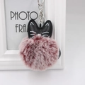 Detail view of fluffy faux fur pompom with leather cat ears and silver keychain clip - 8cm Faux Rabbit Fur / Two-tone Wine Red