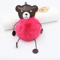 Detail of cute brown bear faux fur keychain with magenta pom-pom and gold spring ring - Rose Red