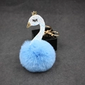Detail of light blue swan faux fur keychain with gold crown and sparkly sequins - Light Blue