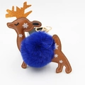 Detailed view of the reindeer keychain with brown leather, blue pompom and gold lobster clasp - Sapphire Blue