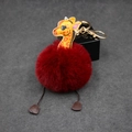 Detail of burgundy plush giraffe keychain with premium leather head and golden metal clasp - 8cm Faux Rabbit Fur / Burgundy