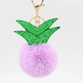 Detail of creative pineapple keychain with purple faux fur pompom and green sequined leaves - Taro Purple