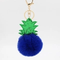 Detail of royal blue fluffy pineapple plush keychain with green glitter leaf and gold clasp - Sapphire Blue