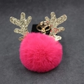 Detail of pink faux fur pompom keychain with golden antlers and metallic ring - 8cm Pompom / Rose Red