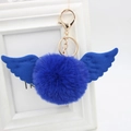 Detail of royal blue faux fur pompom keychain with angel wings and golden clasp - Faux Rabbit Fur / Sapphire Blue