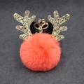 Detail view of a coral orange fluffy reindeer keychain with glittery gold antlers and clasp - 8cm Pompom / Orange Red