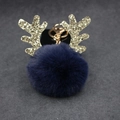 Detail of Christmas reindeer keychain with navy faux fur ball and gold glitter antlers - 8cm Pompom / Navy Blue