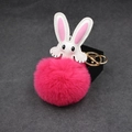 Detail of pink faux fur pompom keychain with white leather bunny ears and gold clasp - Rose Red