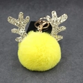 Detail of yellow plush pompom keychain with golden reindeer antlers and metal clip - 8cm Pompom / Yellow