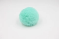 Close-up of mint green fluffy pom-pom with soft faux rabbit fur texture for accessories - 8cm Faux Rex Rabbit Ball / Mint Green