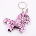 Detail of pink sequin unicorn keychain with silver metal ring on white background - Unicorn-Pink