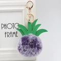Detail of purple faux fur pineapple keychain with green PU leaves and gold metal clip - 8cm / Two-tone Purple