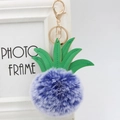 Detail of purple faux fur pineapple keychain with green PU leaves and gold metal clasp - 8cm / Double Blue