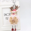 Detail of pink plush reindeer pom-pom keychain with leather reindeer head and festive red hat - Mixed Khaki