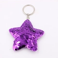 Detailed view of a purple sequin star keychain with shiny silver metal ring and texture - Star-Purple