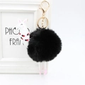 Dettaglio di un portachiavi a pompon nero con un ciondolo a forma di alpaca in pelle - 8cm Pelliccia di Coniglio Sintetica / Nero