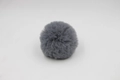 Detail of dark grey faux fur pompom showing soft synthetic fiber texture and round shape - 8cm Faux Rex Rabbit Ball / Dark Gray