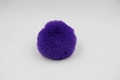 Detailed view of a soft fluffy faux rabbit fur pom pom in deep purple for bag accessories - 8cm Faux Rex Rabbit Ball / Dark Purple