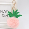 Detail of pineapple faux fur pompom keychain with green leather leaves and gold clasp - 8cm / Pink