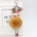 Close-up of reindeer plush ball keychain with a red Santa hat and metal lobster clasp - Silver Hook / Coffee