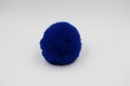Close-up of royal blue faux fur pompom with soft texture and uniform round shape - 8cm Faux Rex Rabbit Ball / Sapphire Blue