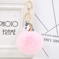 Pink faux fur pompom keychain with colorful unicorn pendant and golden metal ring - Light Pink