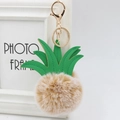 Detailed view of fur pineapple keychain with green PU leather leaves and golden clasp - 8cm / Mixed Khaki
