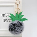 Faux fur pineapple keychain with green leather leaves and golden metal clasp on white background - 8cm / Two-tone Black