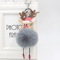 Detail of reindeer plush pom-pom keychain with silver metal lobster clasp and holiday hat - Dark Gray