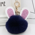 Detail of navy blue faux fur rabbit ear keychain with pink glitter and gold hardware - Gold Key Chain Style / Navy Blue