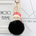 Detail of Santa Claus leather charm with soft large black faux fur pompom and gold keychain - Black