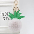 Detail of a pink pineapple faux fur pompom keychain with green leather leaves and gold hardware - 8cm / Light Gray