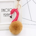 Detail of plush flamingo keychain with gold metal ring and pink faux leather head - Coffee and Rose
