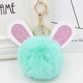 Detail of mint green plush bunny keychain with pink glitter ears and gold alloy clasp - Gold Key Chain Style / Mint Green