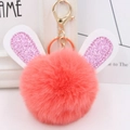 Detail of coral pink fluffy rabbit ear keychain with sparkling glitter ears and gold clasp - Gold Key Chain Style / Orange Red