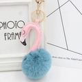 Detail of flamingo keychain featuring a blue faux fur pompom and pink leather neck - Peacock Blue and Pink