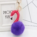 Detail of pink plush flamingo keychain with gold alloy ring and faux fur texture - Purple and Rose