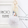 Detail of colorful unicorn keychain with grey faux fur pompom and golden alloy buckle - Light Gray