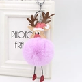 Close-up of pink faux fur Christmas reindeer keychain with silver metal hook and red hat - Taro Purple
