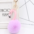 Detail of flamingo keychain featuring pink faux leather neck and purple plush pom pom - Taro Purple and Pink