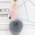 Detail of pink leather flamingo head and grey faux fur pom pom keychain with gold clasp - Dark Gray and Pink