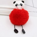 Close-up of fluffy red panda pompom keychain with soft faux fur and leather details - Red