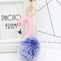 Detailed view of plush flamingo keychain with purple faux fur pompom and golden clasp - Two-Tone Blue and Pink