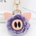 Detail of cute purple plush pig keychain with soft faux fur and pink PU leather snout - Gold Key Chain Style / Two-tone Purple
