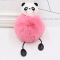 Close-up of a fluffy pink plush ball keychain with a cute panda head and dangling legs - Deep Pink