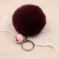 Detail of fluffy burgundy faux fur pompom keychain with pink bell and silver ring - 8cm Faux Rabbit Fur With Bell / Purplish Red